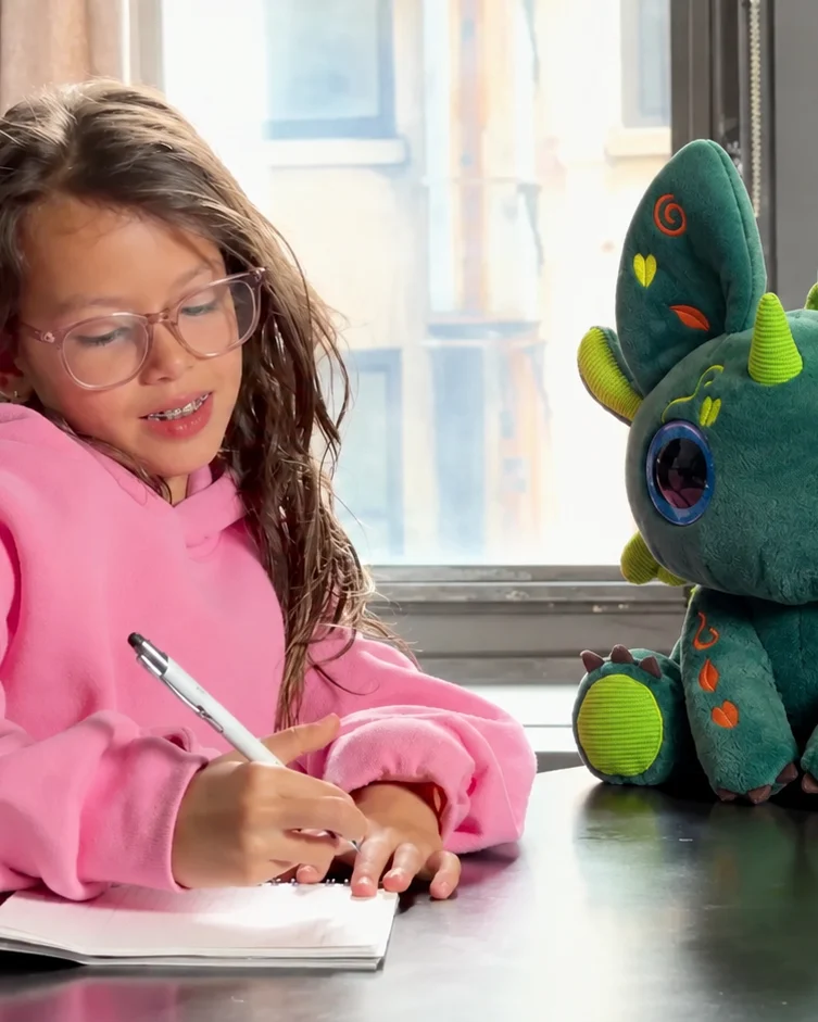 Two Bloom characters, one green and one pink, sitting side by side on a stone ledge in front of a Manhattan fountain.